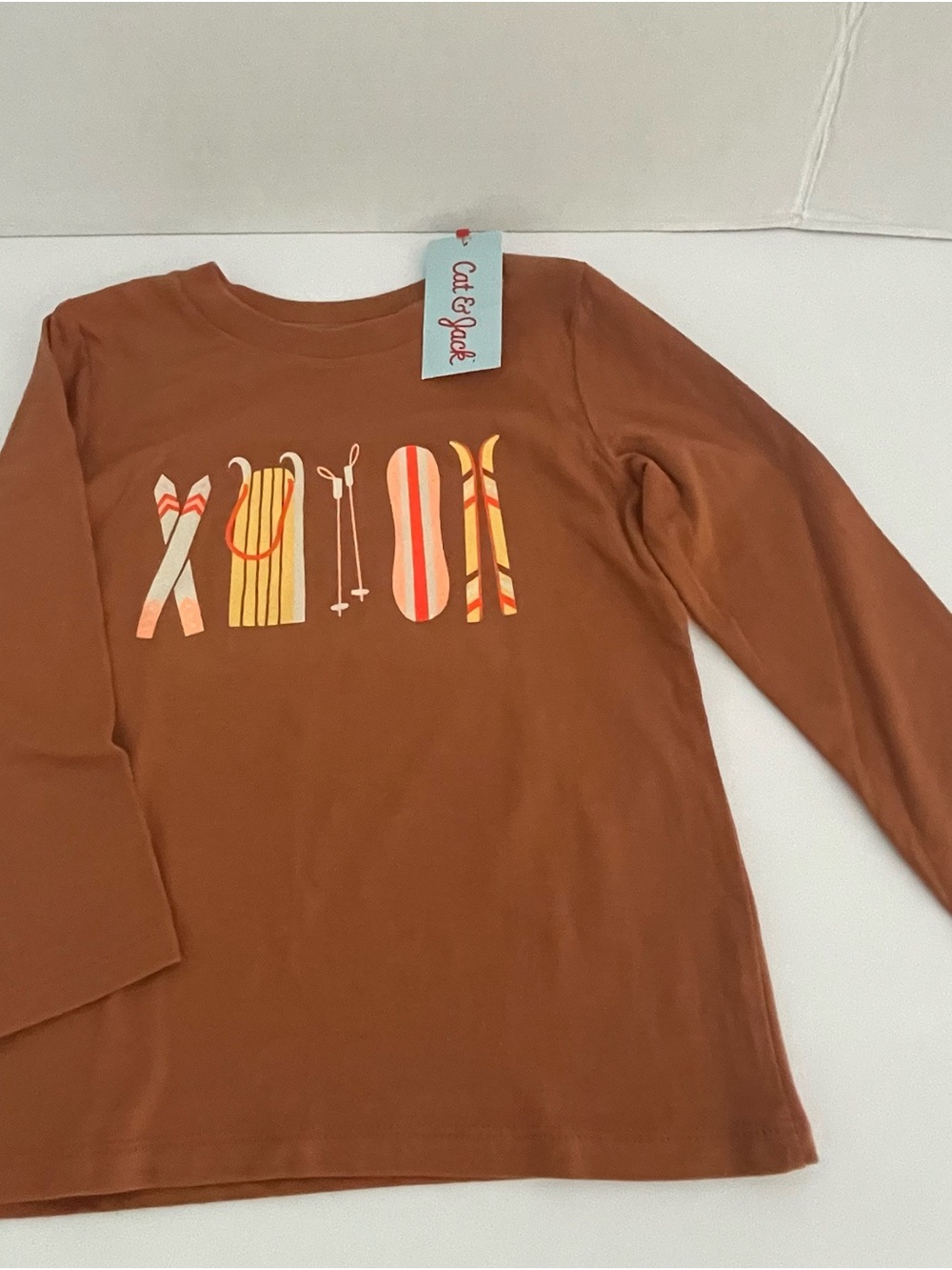 Cat & Jack Rust Brown Long Sleeve Tee with Winter Sports Graphic